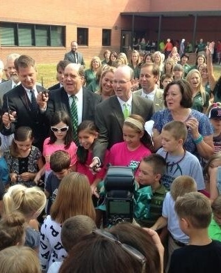 The Carter Elementary School ribbon cutting. Where there are more kids than scissors. At least Burchett and McMillan are holding up the scissors away from the students