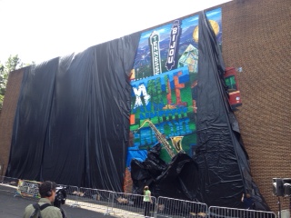 After a count of 3, 2, 1, the plastic began to drop to reveal the mural. 