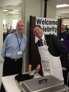 Tom Mattingley, the Vol Historian and Board Member of the O'Connor Center inspecting the pancakes by celebrity cooks. Because some complained of half baked ones. Half baked pancakes not celebrity cooks. Mayor Burchett here blocking Mattingley's view of his pancakes. 