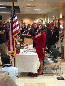 Marilyn and State Representative Kent Calfee during the Pledge of Allegiance at the beginning of the dinner.