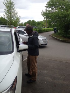 Volunteer "Frank" allowing citizens to sign a petition to Impeach Obama