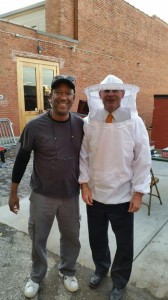 Covington with bee keeper State Rep. Bill Dunn