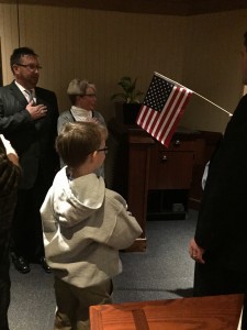 Trace Nystrom leads the Pledge of Allegiance at the West Knox Republican Club