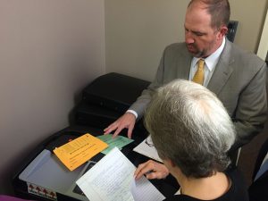 Assistant Elections Administrator Chris Davis explaining the two provisional ballots and all the paper given to a provisional voter at the polling location when they cast a provisional ballot. 