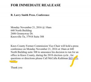 A picture of the press release with a phone number redacted. 