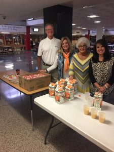 Knox County Register of Deeds Sherry Witt along with Billy Bright, Sandy Merriman and Debbie Davis served juice and Sausage Biscuits. Witt delivering the pork!