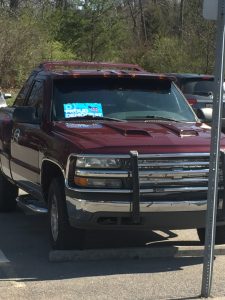 A truck parked in the handicapped spot with a Proud Democrat sign. Is the sign, the truck the Proud Democrat?