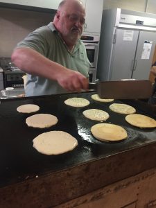 Longtime Knox County Community Activist and Kiwanis officer Walt Wojnar takes his turn flipping the pancakes. 