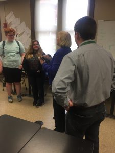 Senator Massey talking with a small group of students after her time with the class