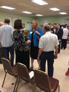 District 4 candidate Lauren Ridet talking with attendees.