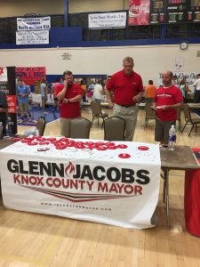 Knox County Mayor candidate Glenn Jacobs and his campaign team had frisbees and stickers. Jacobs posed for many photographs and signed autographs 