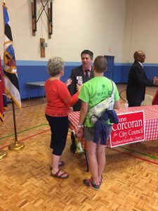 Corcoran talking with voters. 
