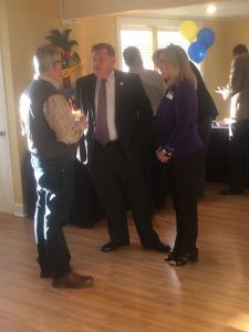 2018 Knox County Register of Deeds Candidate Nick McBride and 2018 Knox County Clerk candidate Sherry Witt talking with an event host.