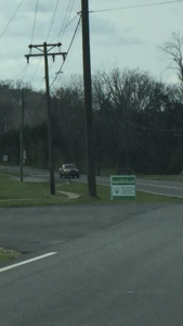 A Rountree sign on South Doyle High property in violation of School Board Policy and obstructing the traffic at the student exit. 