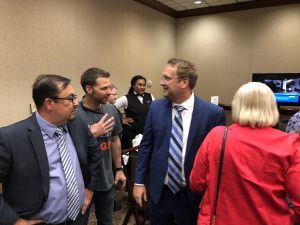 Biggs being greeted upon entering the ballroom