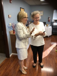Diane Black and Stacey Dunn look at the photo of the 5th Dunn grandchild that was born 8 hours earlier