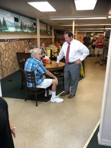 Spangler visiting with patrons 