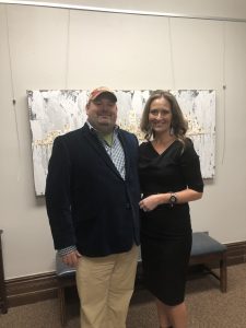 Rebecca Muth and I in front of her skyline of Knoxville painting 