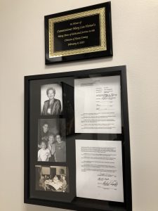 The dedication plaque, three photos of Commissioner Horner and the Resolution honoring the Memory of Horner.