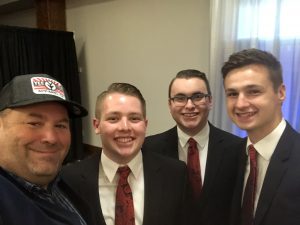 three young men from The Crowne College of the Bible sang the National Anthem