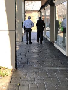 Schoonmaker and Jay walking to their cars 