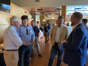 Biggs talking to Jordan Mollenhour, former County Mayor Mike Ragsdale talking to Attorney Clayton Wood