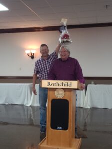 two former County Republican Party Chairs acting as auctioneer and helper, Buddy Burkhardt, Auctioneer and Randy Pace as the assistant 