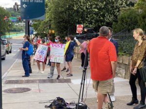 television station (I believe Channel 8) interviewing some demonstrators. 