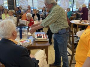 Burkhardt unveiling the Judge Cerny Puddin’ cake 